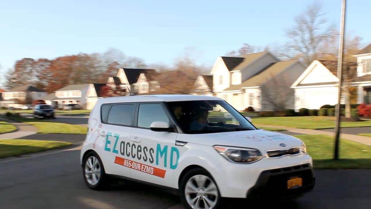 An EZaccessMD medical technician arriving at a home with X-Ray and diagnostic equipment